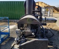 Industrial machinery outdoors on a sunny day.