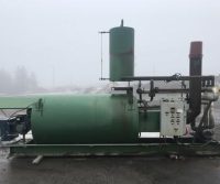 Industrial equipment on a foggy day outdoors.