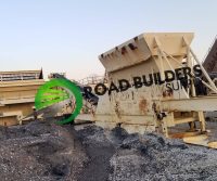 Industrial machinery in a construction site landscape.