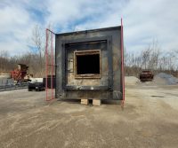 Industrial furnace in outdoor setting.