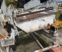 Rusty industrial machinery in outdoor setting.