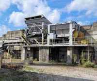 Industrial equipment structure under a blue sky.