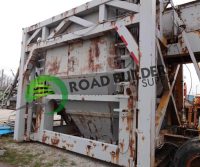 Rusty industrial machinery with green logo.