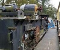 Old industrial machinery with gears and motors.