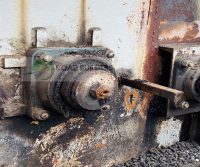 Rusted industrial machinery with metal components.